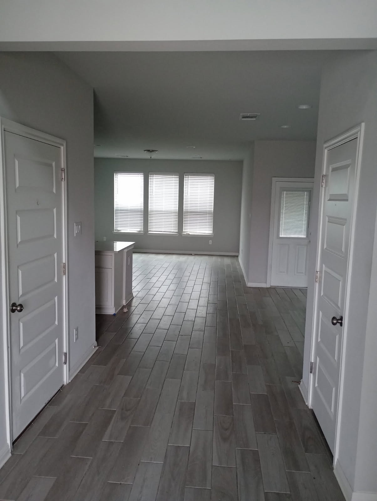 336 Mclintock Road Jarrell, TX 76537 - Photo 6 of 14 wooden floor in an empty room with a window