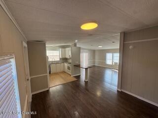 3406 Frankie Lane Cocoa, FL 32926 - Photo 3 of 14 wooden floor in an empty room with a window