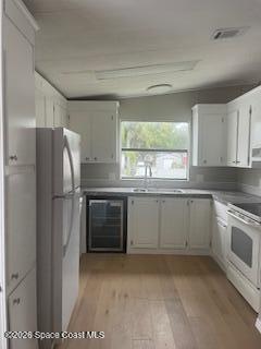 3406 Frankie Lane Cocoa, FL 32926 - Photo 5 of 14 a kitchen with a refrigerator and window