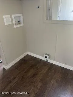 an empty room with wooden floor