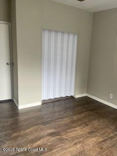 3406 Frankie Lane Cocoa, FL 32926 - Photo 8 of 14 a view of an empty room with wooden floor