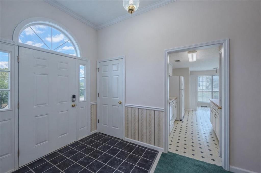 30 Cinnamon Fern Circle Covington, GA 30016 - Photo 2 of 27 wooden floor in a room with a mirror