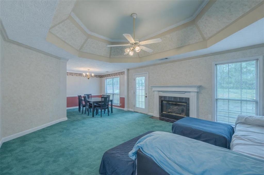30 Cinnamon Fern Circle Covington, GA 30016 - Photo 3 of 27 a living room with furniture and a fireplace