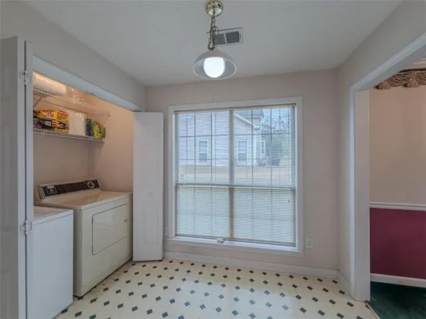 a room with a stove and a window