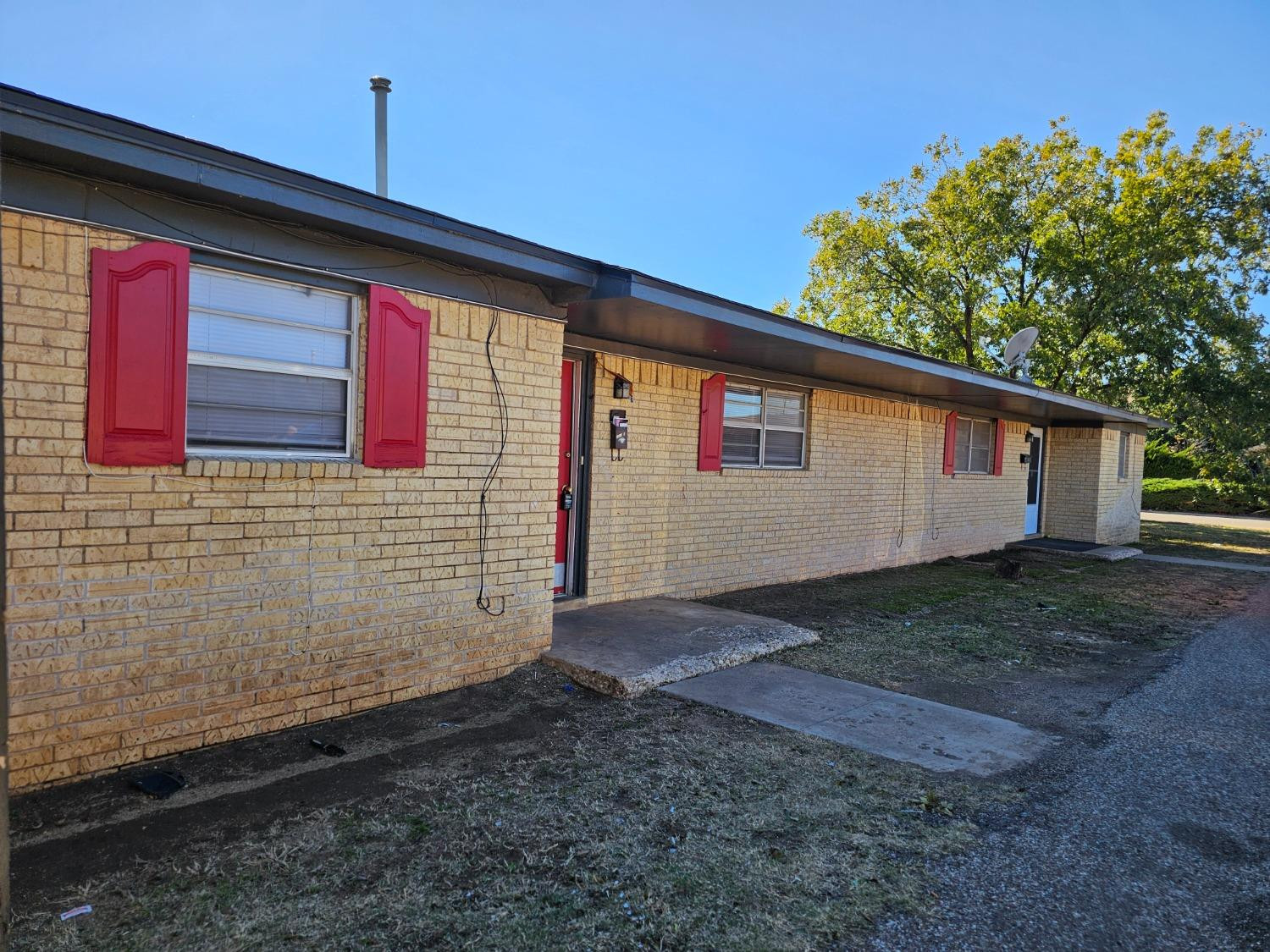 6501 Avenue R, Unit 6503 Lubbock, TX 79412 - Photo 2 of 11 a view of a house with backyard