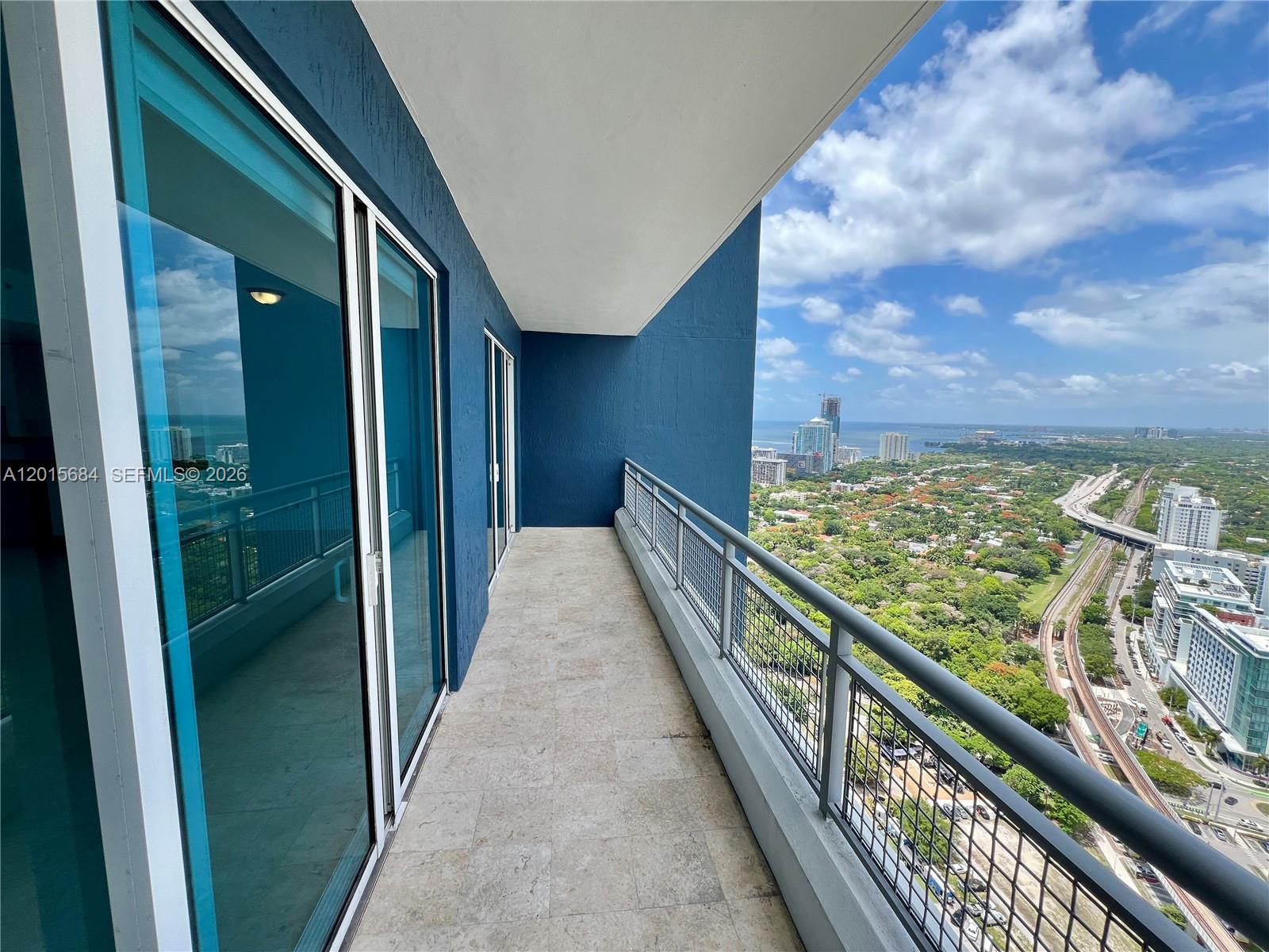 60 Southwest 13th Street, Unit 3609 Miami, FL 33130 - Photo 12 of 24 a view of balcony with wooden floor