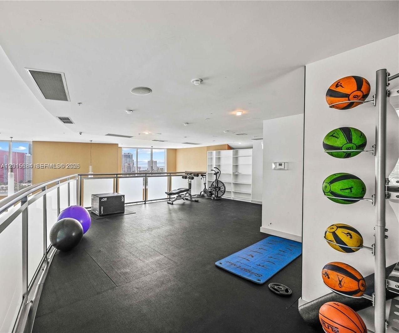 60 Southwest 13th Street, Unit 3609 Miami, FL 33130 - Photo 22 of 24 a view of a room with gym equipment