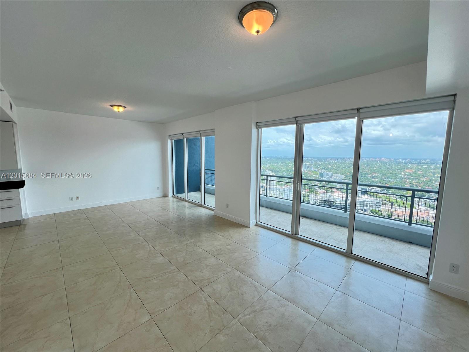 60 Southwest 13th Street, Unit 3609 Miami, FL 33130 - Photo 3 of 24 a view of an empty room and window