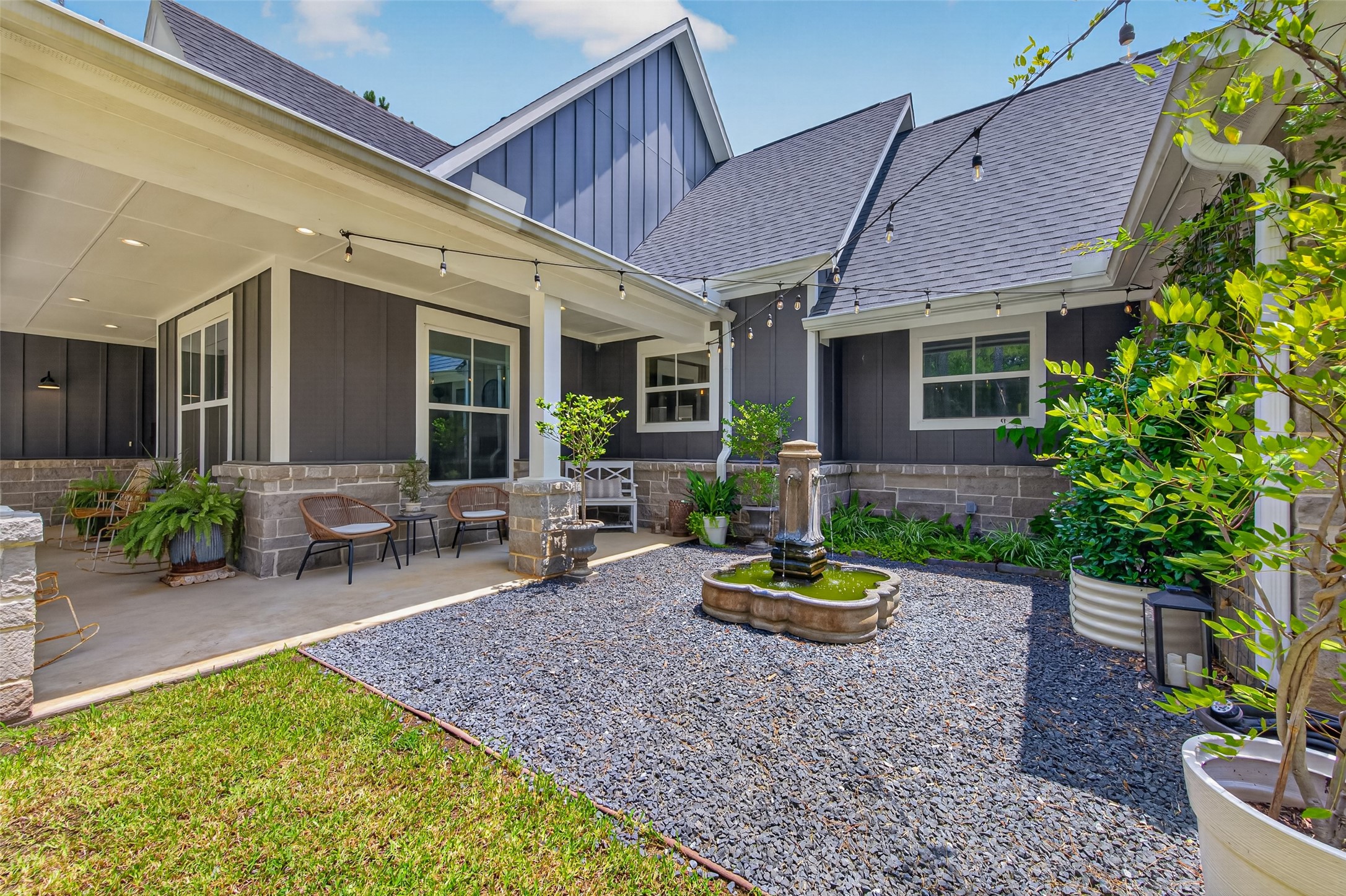 10915 Ruger Road Willis, TX 77378 - Photo 3 of 50 A serene garden courtyard featuring a charming Round Top fountain.
