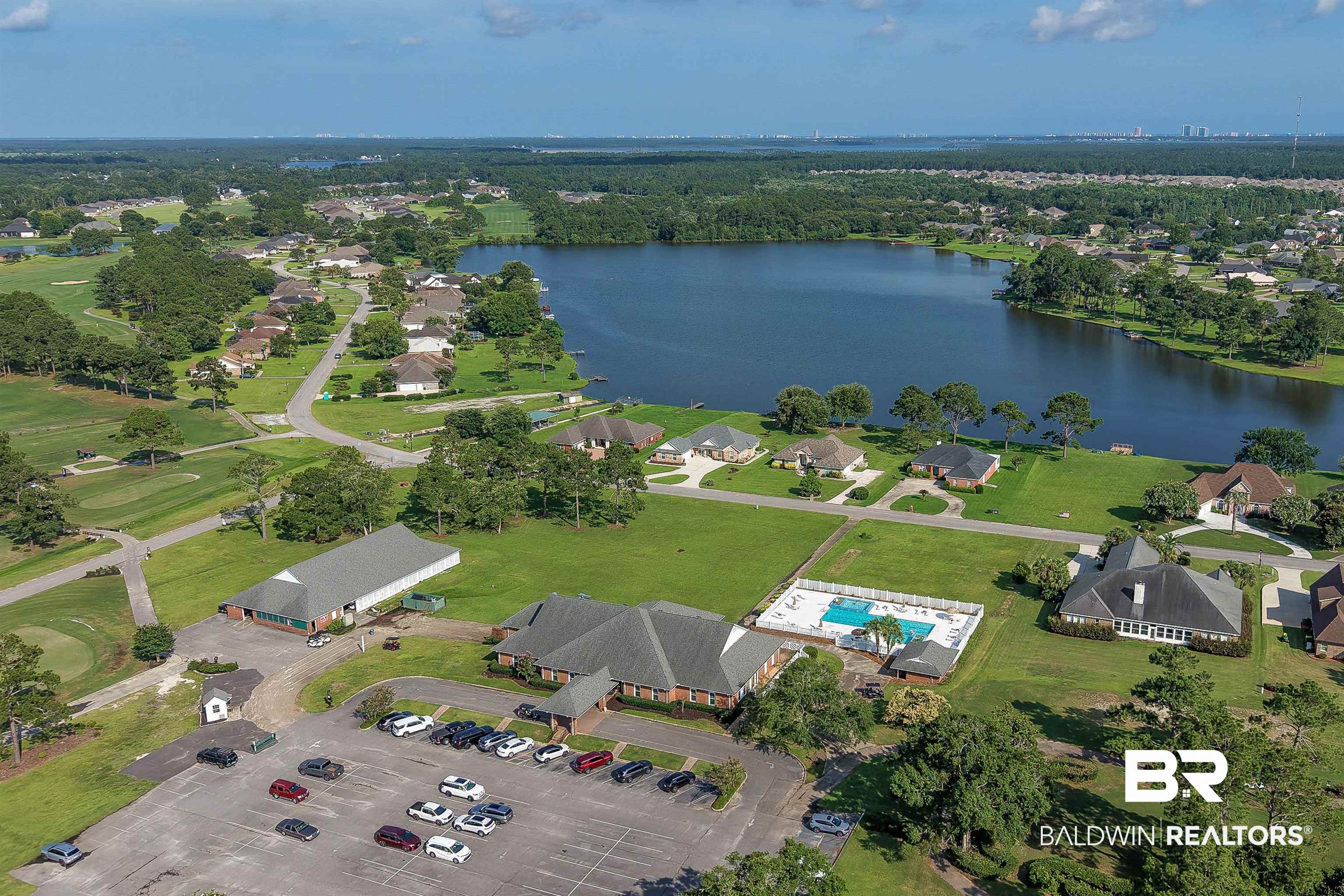 22685 County Road 12 Foley, AL 36535 - Photo 85 of 89 Aerial view showcasing a community with a prominent lake, extensive green spaces, and a golf course