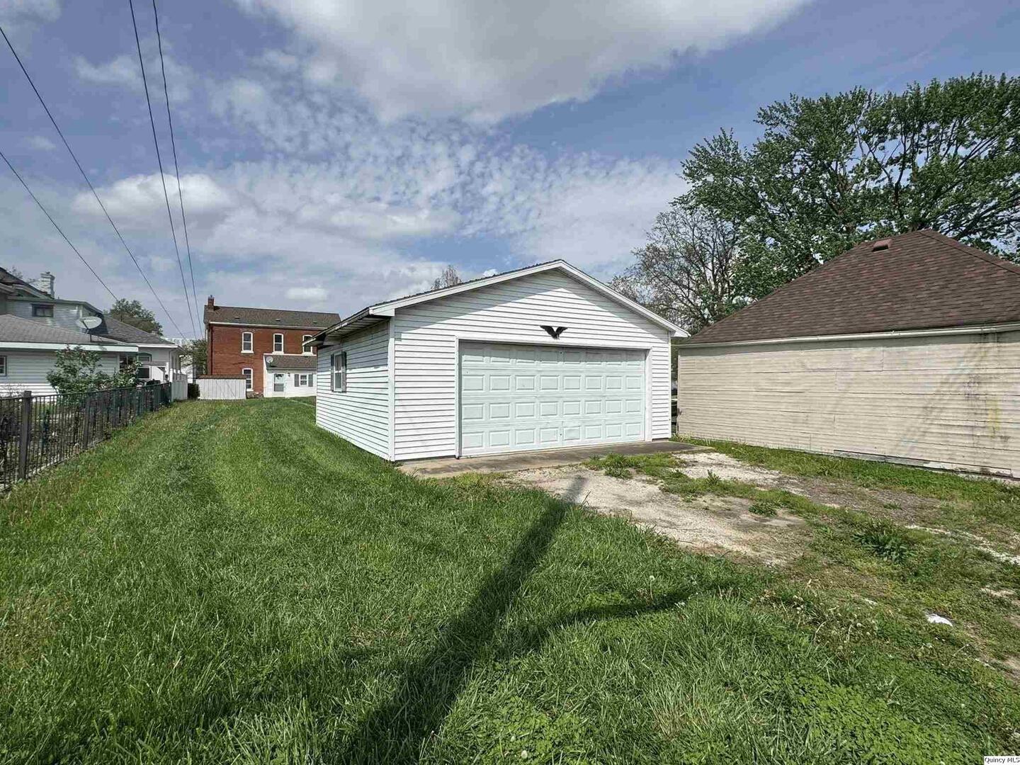 608 Adams Street Quincy, IL 62301 - Photo 19 of 19 a view of a backyard with a garden