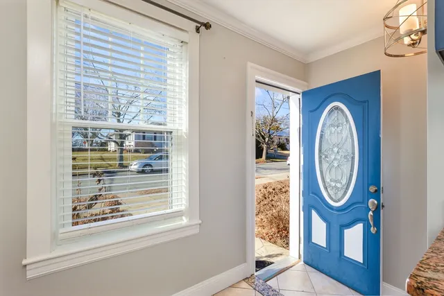 a front view of a house with large windows
