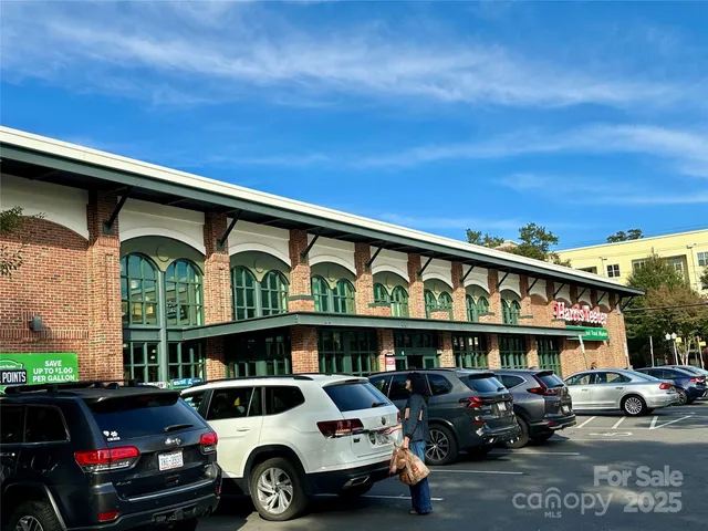 a view of a cars park in front of building