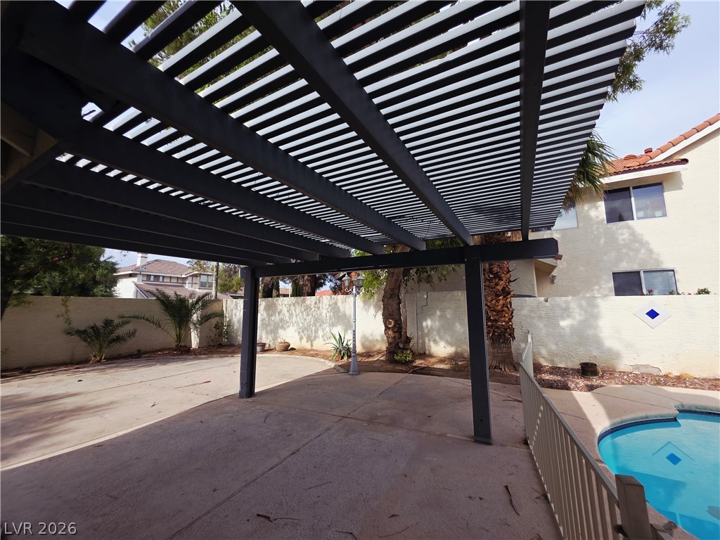 2920 Setting Sun Street Las Vegas, NV 89117 - Photo 42 of 43 An inviting outdoor space featuring a pergola, perfect for al fresco living.