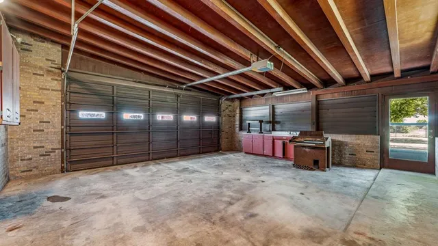a view of a garage room with wooden walls
