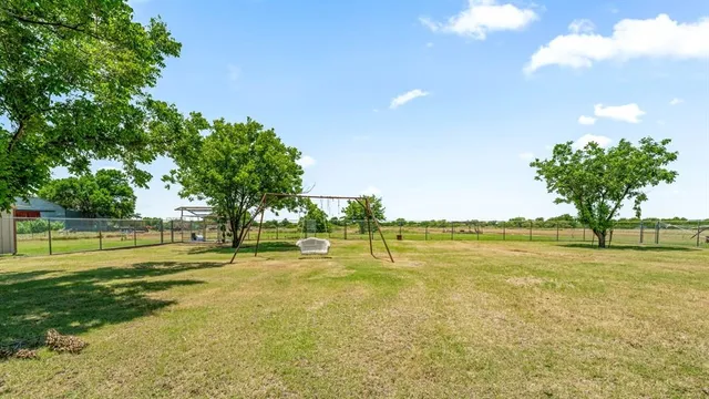 a view of an ocean and a yard