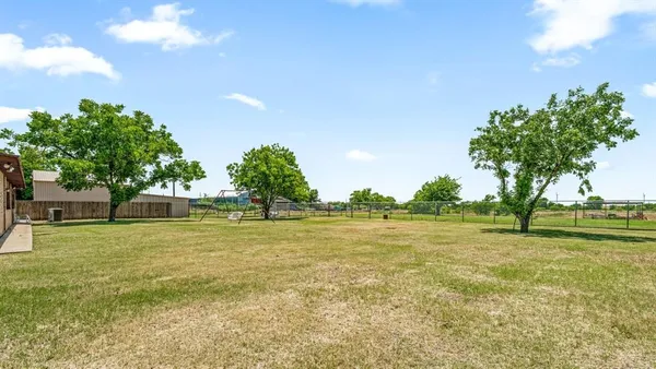 a view of an ocean and yard