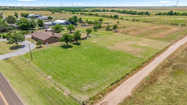 a view of a lake with a yard