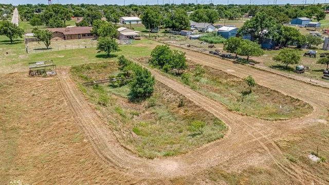 a view of a swimming pool with a yard