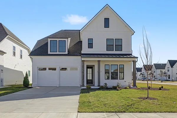 a view of a yard in front of a house