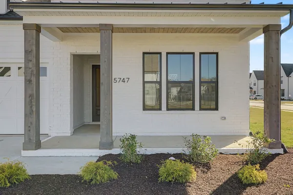 a view of a swimming pool with an outdoor seating