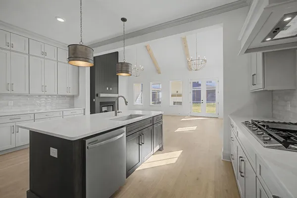 a view of an empty room with a fireplace and a window