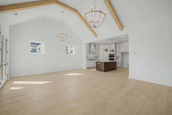 a view of an empty room with windows