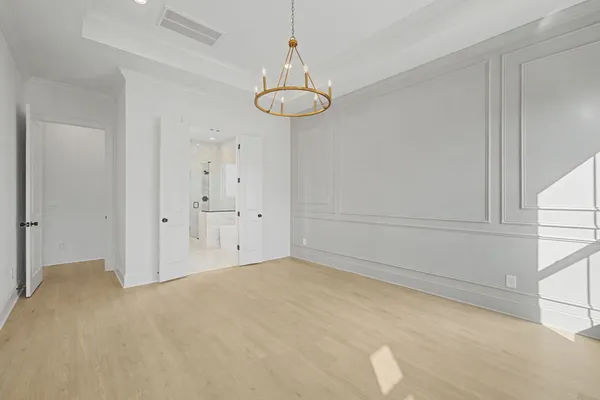 a spacious bathroom with a double vanity sink a mirror and a shower