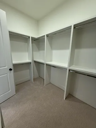 a view of an empty walk in closet