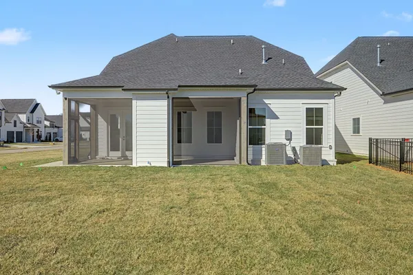 a front view of house with yard and seating area