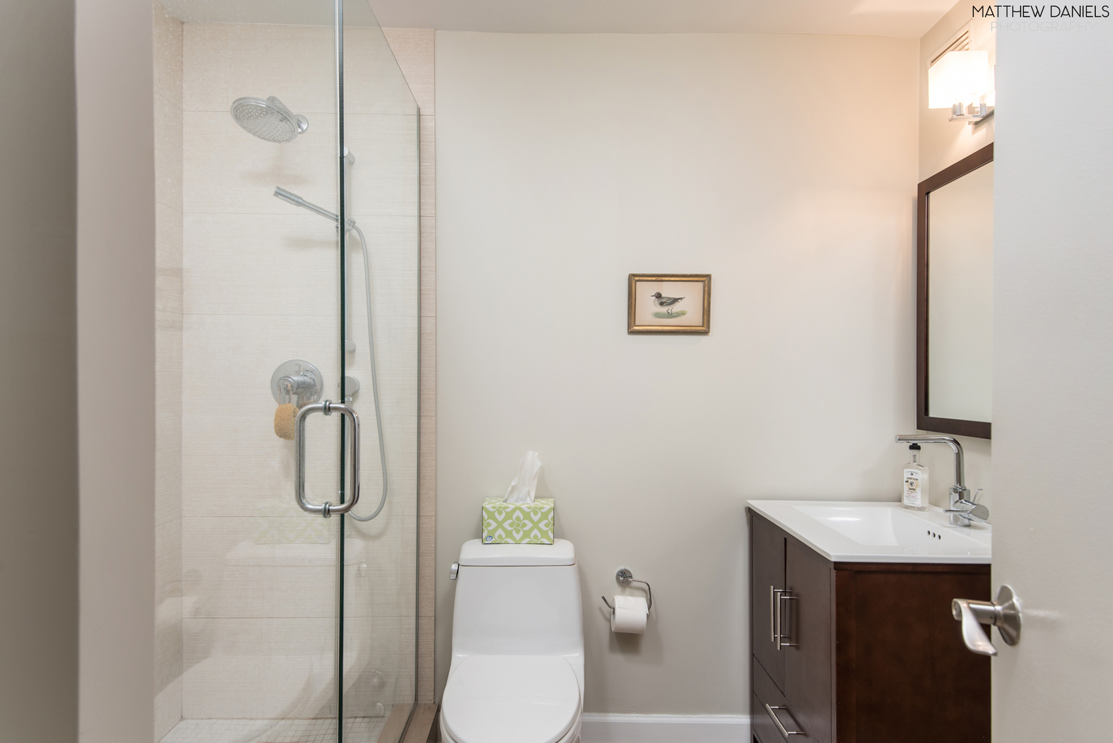 5415 North Sheridan Road, Unit 1806 Chicago, IL 60640 - Photo 19 of 38 a bathroom with a shower a toilet and sink