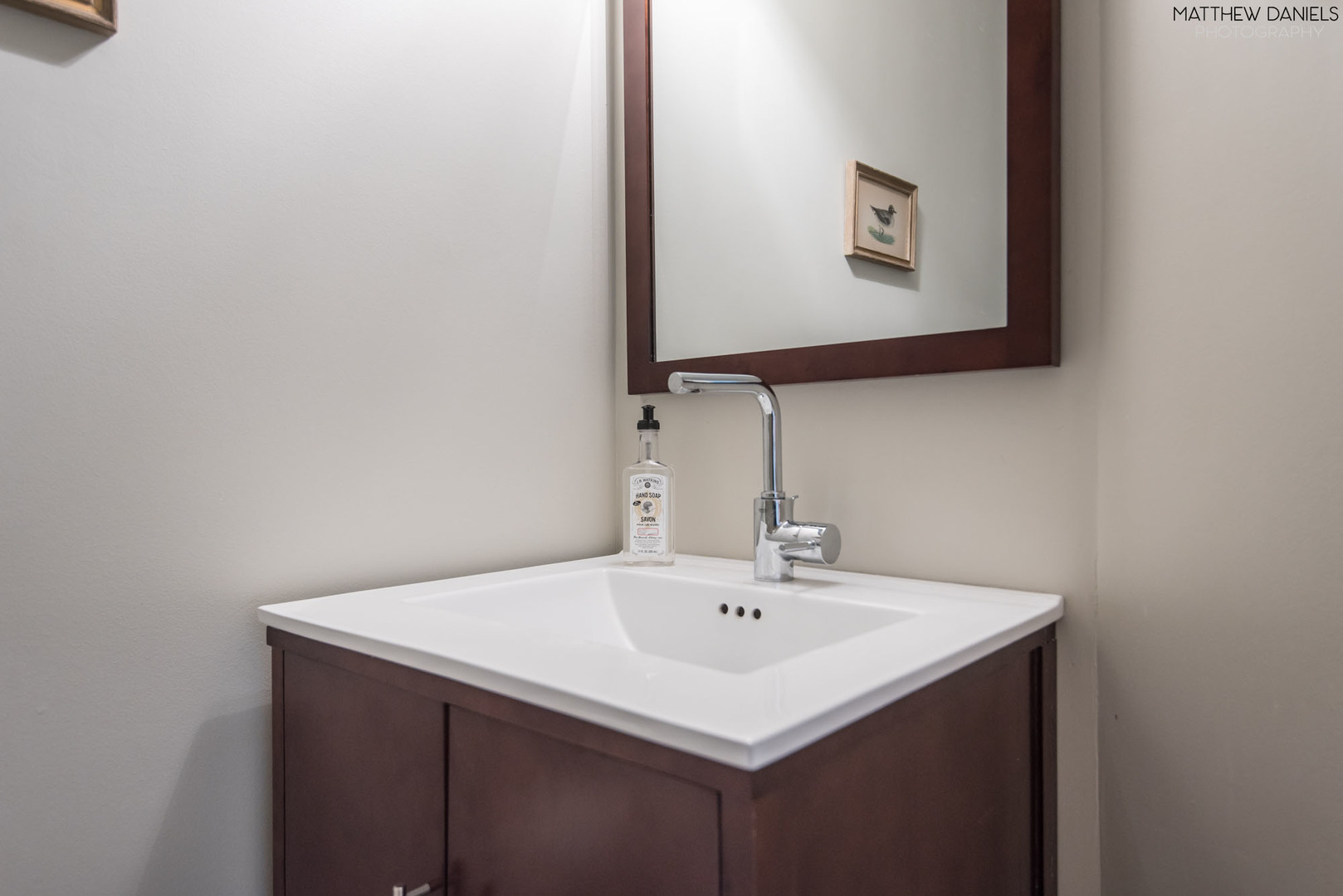 5415 North Sheridan Road, Unit 1806 Chicago, IL 60640 - Photo 21 of 38 a bathroom with a sink and a mirror
