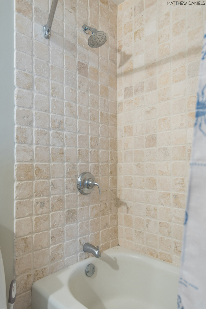 5415 North Sheridan Road, Unit 1806 Chicago, IL 60640 - Photo 25 of 38 a bathroom with a sink and a shower