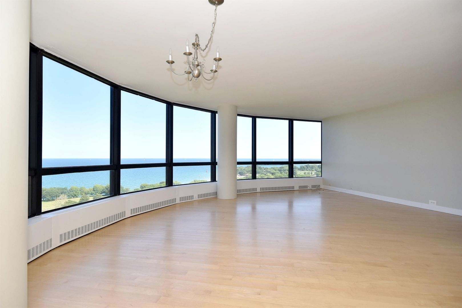 5415 North Sheridan Road, Unit 1806 Chicago, IL 60640 - Photo 6 of 38 a view of an empty room with a window