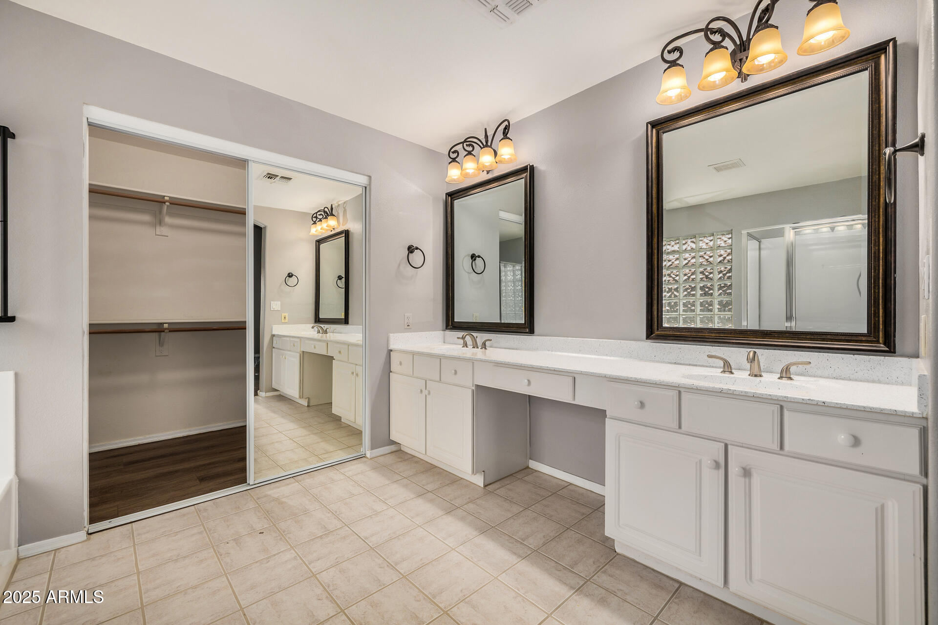 15002 South 47th Street Phoenix, AZ 85044 - Photo 24 of 41 a spacious bathroom with a double vanity sink and a mirror