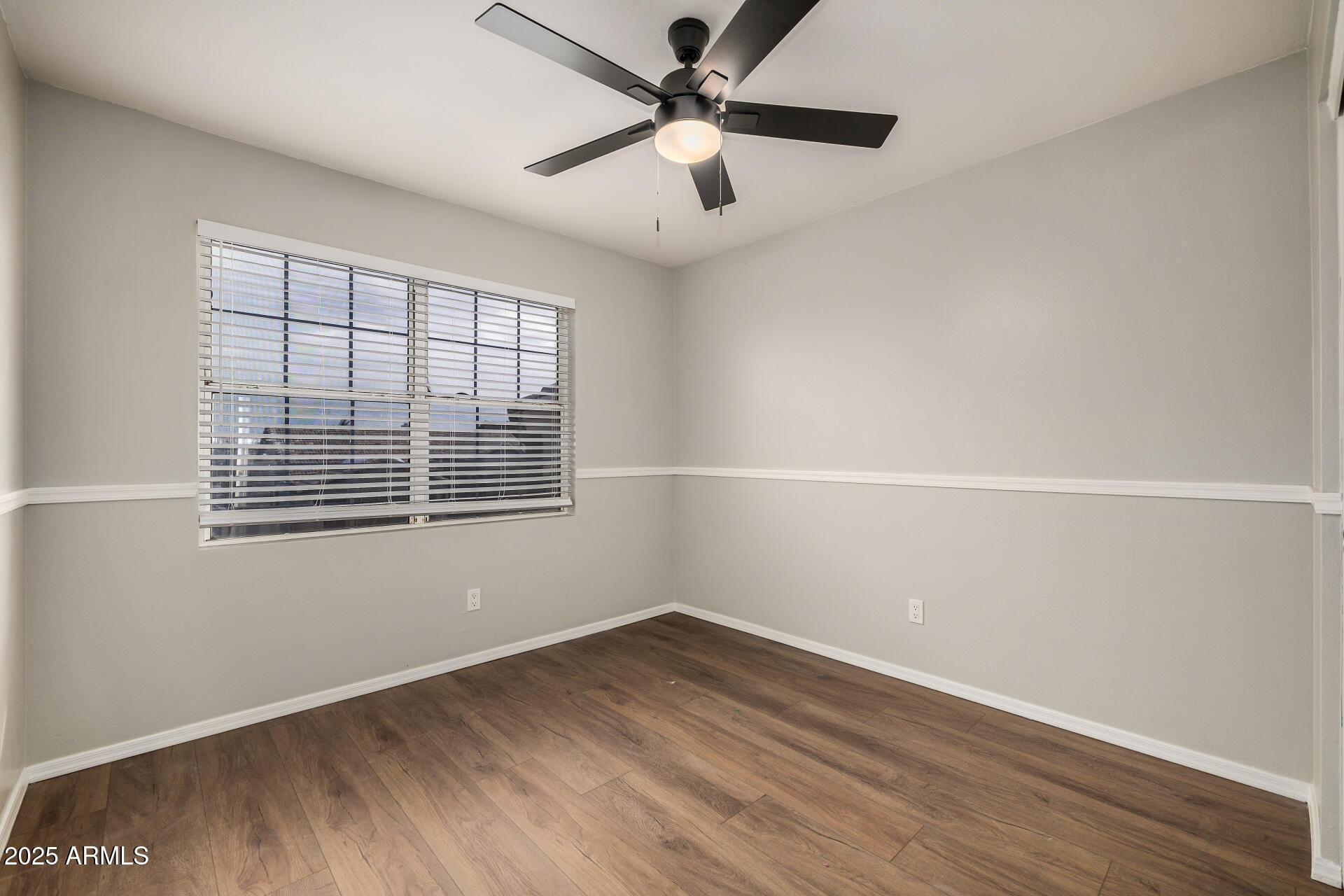 15002 South 47th Street Phoenix, AZ 85044 - Photo 26 of 41 an empty room with a window and a ceiling fan