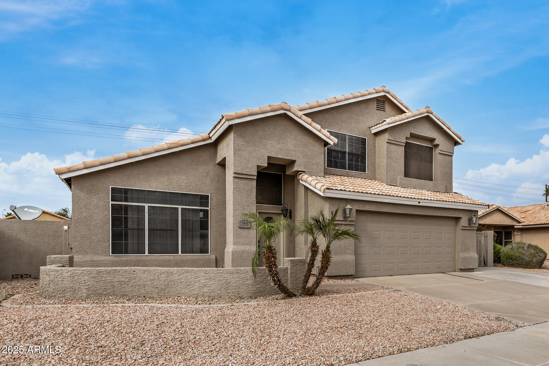 15002 South 47th Street Phoenix, AZ 85044 - Photo 6 of 41 a view of a house with a balcony and garage