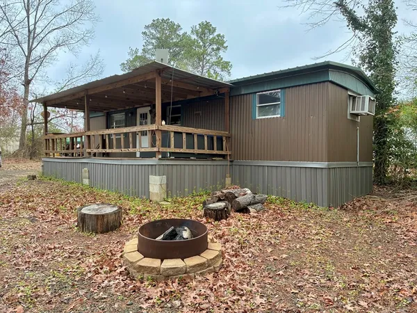 a balcony with table and chairs