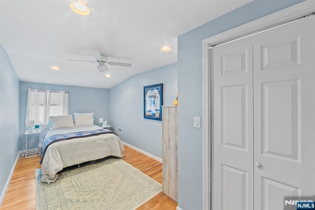 2 Overbrook Place Hillsdale, NJ 07642 - Photo 30 of 49 a spacious bedroom with a bed and a chandelier