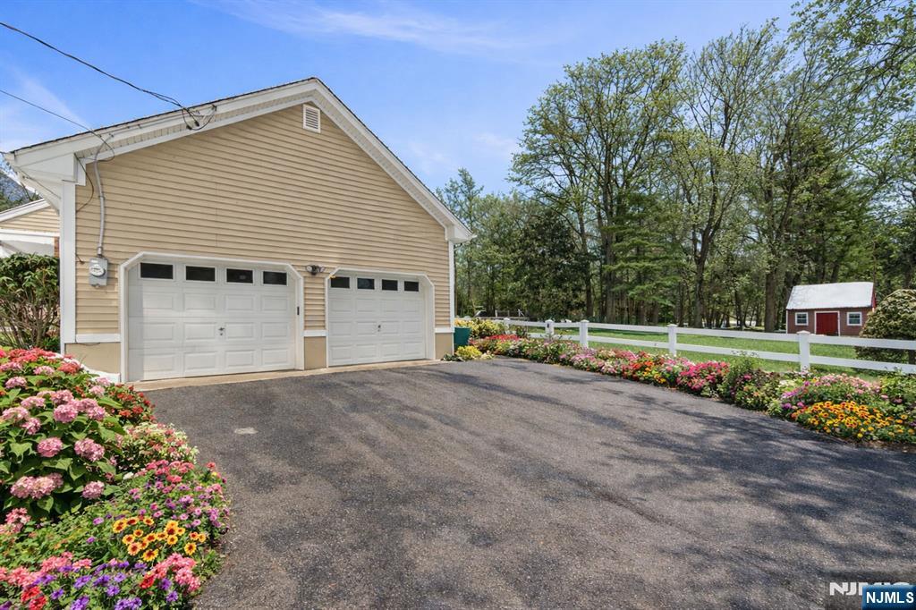 2 Overbrook Place Hillsdale, NJ 07642 - Photo 33 of 49 a view of a house with a backyard and a garage