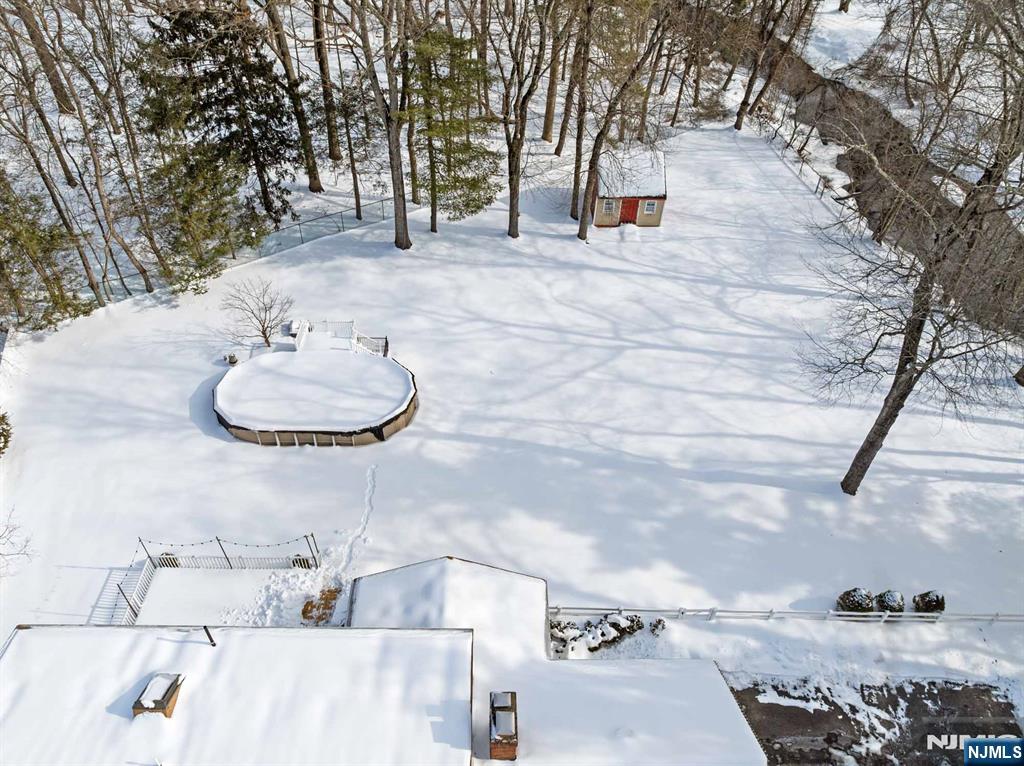 2 Overbrook Place Hillsdale, NJ 07642 - Photo 43 of 49 a backyard of a house with table and chairs