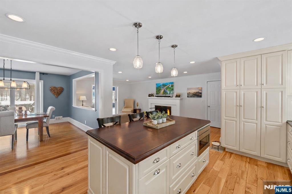 2 Overbrook Place Hillsdale, NJ 07642 - Photo 10 of 49 a kitchen with kitchen island granite countertop a sink cabinets and wooden floor