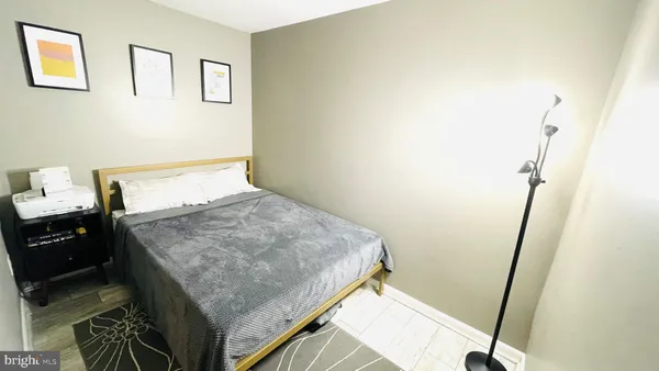 a bedroom with a stove and a sink