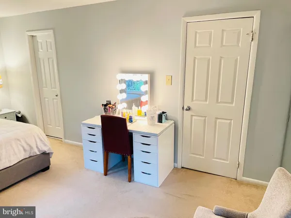 a bedroom with a bed and furniture