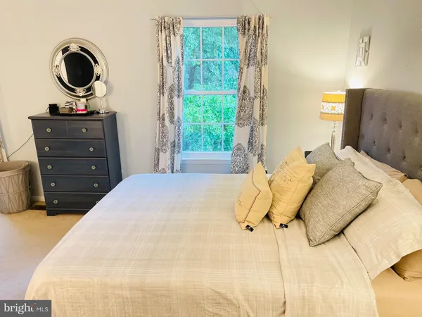 a bedroom with a bed and cabinets