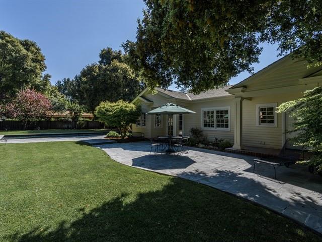 24 Edge Road Atherton, CA 94027 - Photo 28 of 34 a view of a patio with table and chairs potted plants and large tree