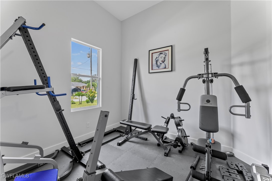 3002 42nd Street Southwest Lehigh Acres, FL 33976 - Photo 15 of 25 a view of a room with gym equipment