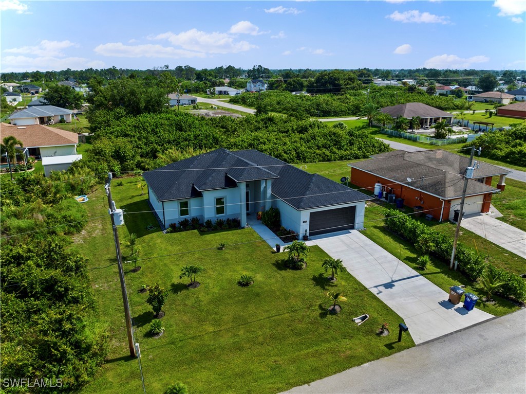 3002 42nd Street Southwest Lehigh Acres, FL 33976 - Photo 24 of 25 an aerial view of a house