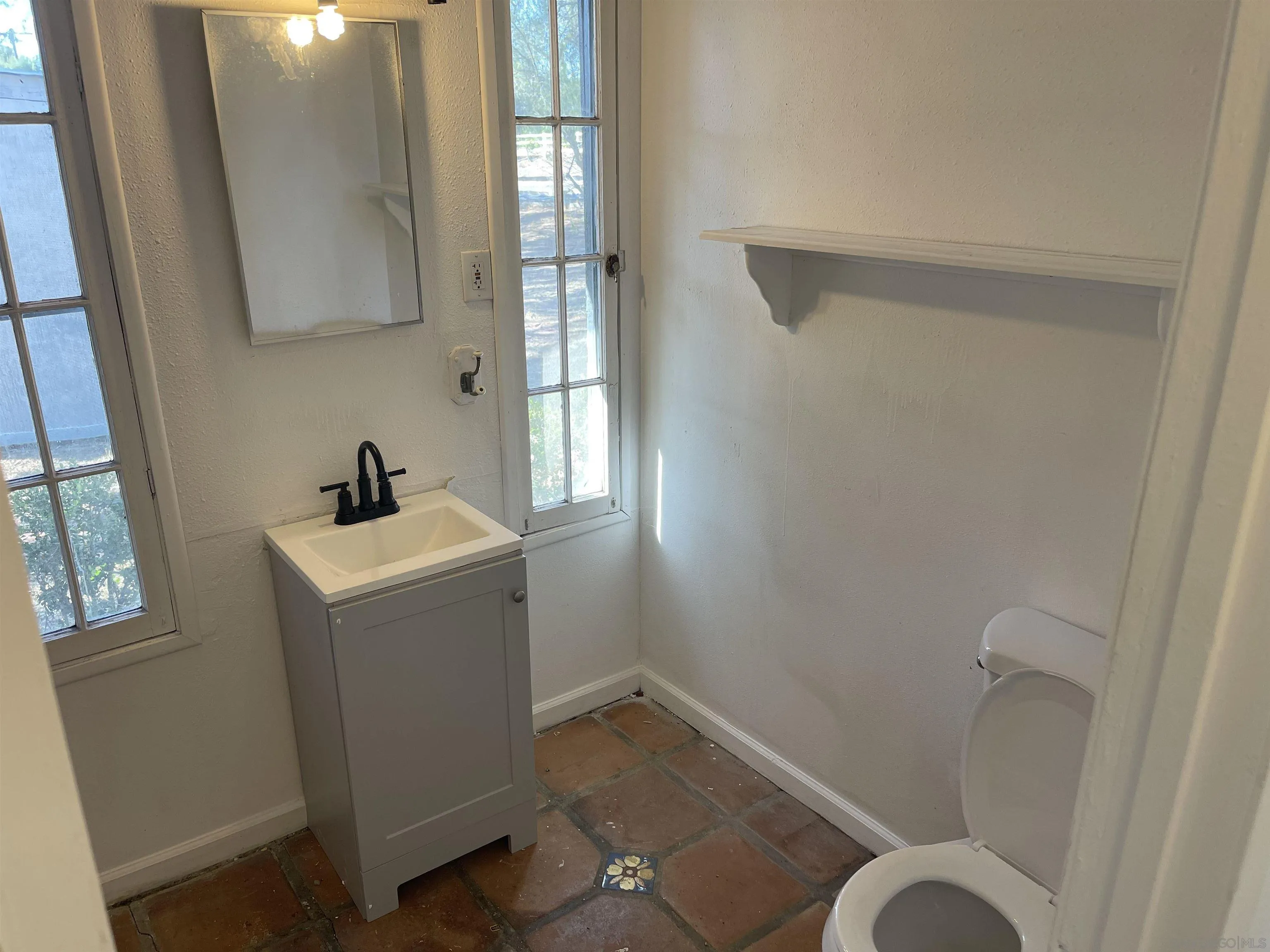 1367 Green Canyon Road Fallbrook, CA 92028 - Photo 15 of 42 a bathroom with a sink and toilet