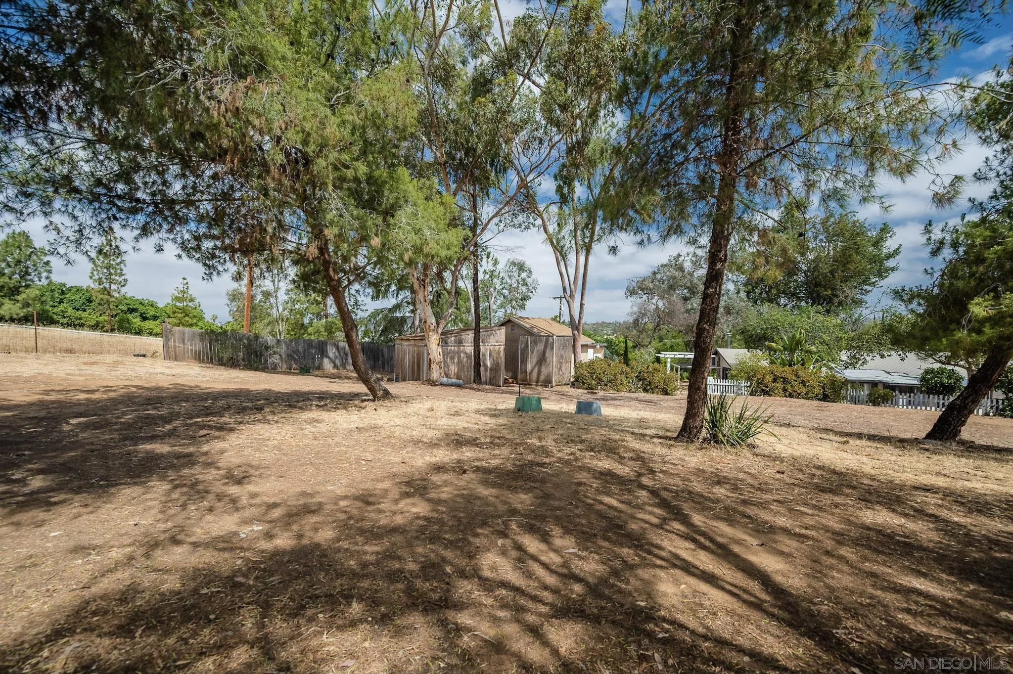 1367 Green Canyon Road Fallbrook, CA 92028 - Photo 22 of 42 a view of a yard with trees